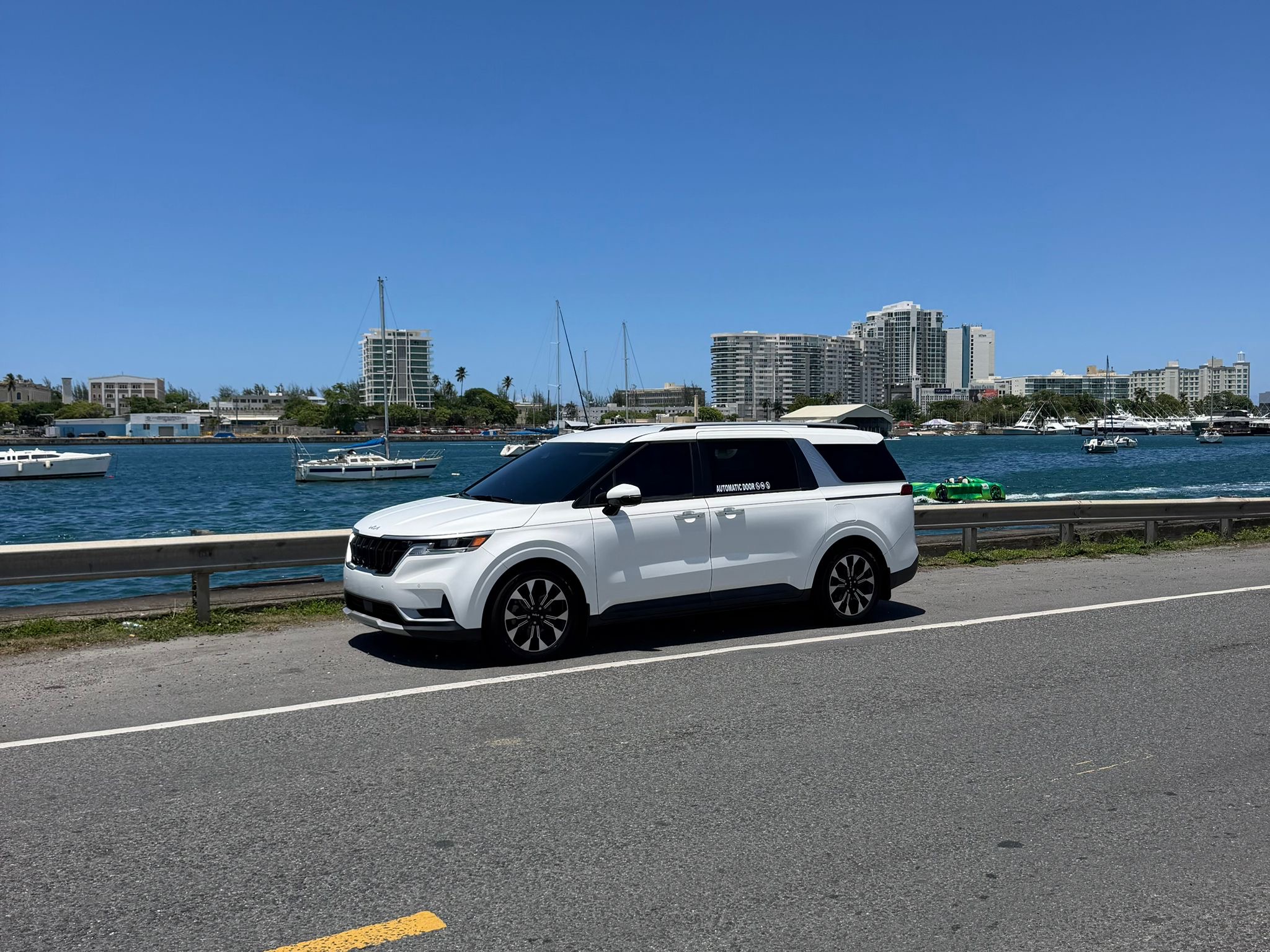 DP Transport white SUV for airport transfers on waterfront road