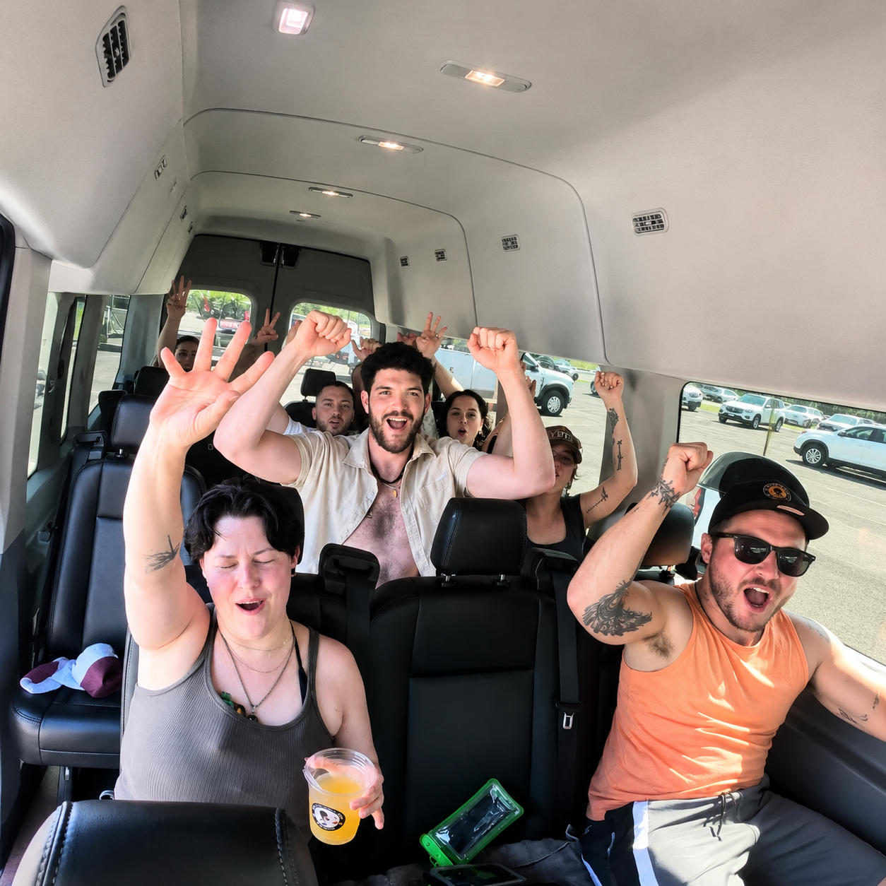 Guests celebrating in the tour van on the way to the cave