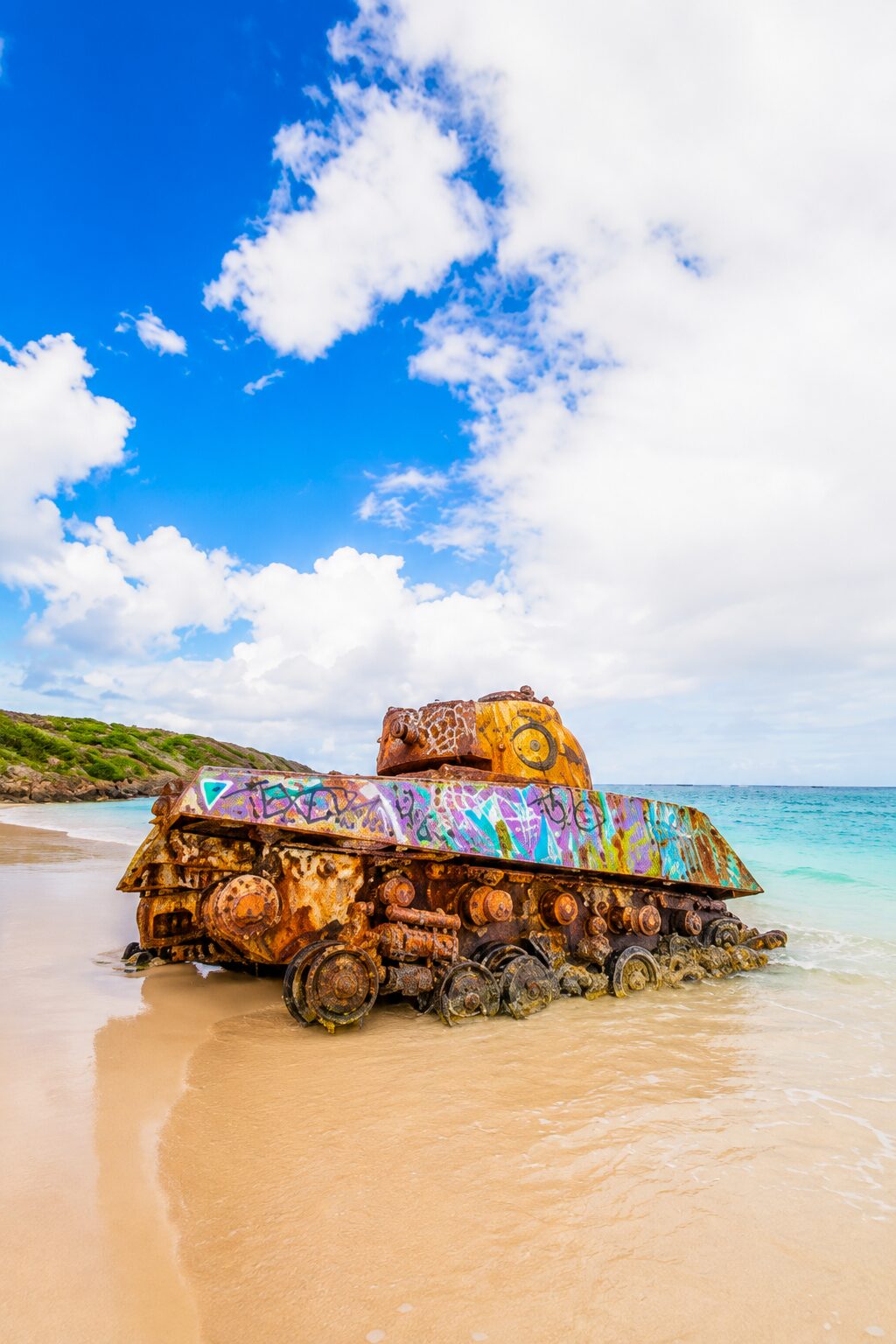 Graffiti-covered tank on the sand at Playa Flamenco, Culebra