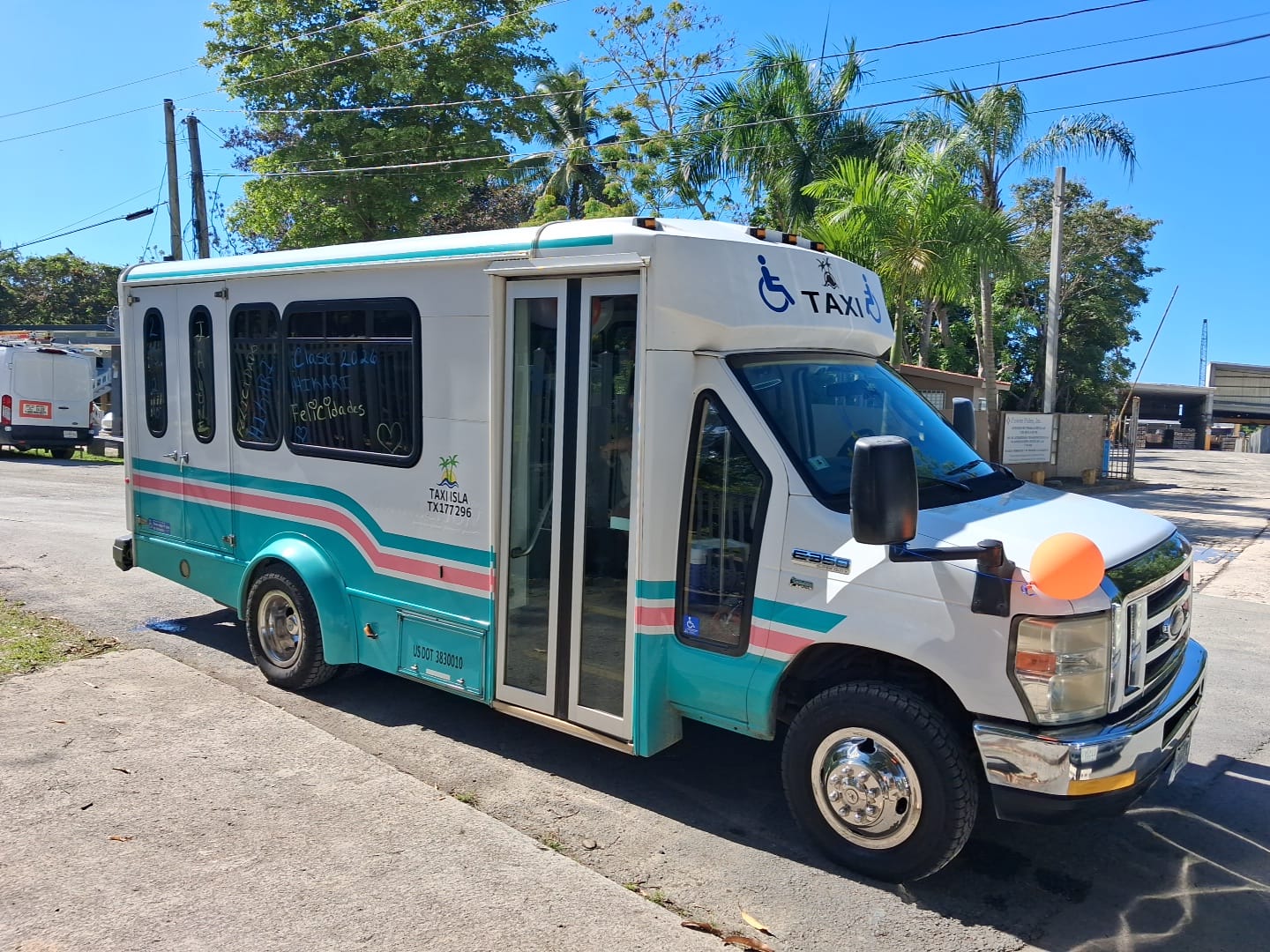 Front view of DP Transport wheelchair-accessible taxi van with accessibility markings