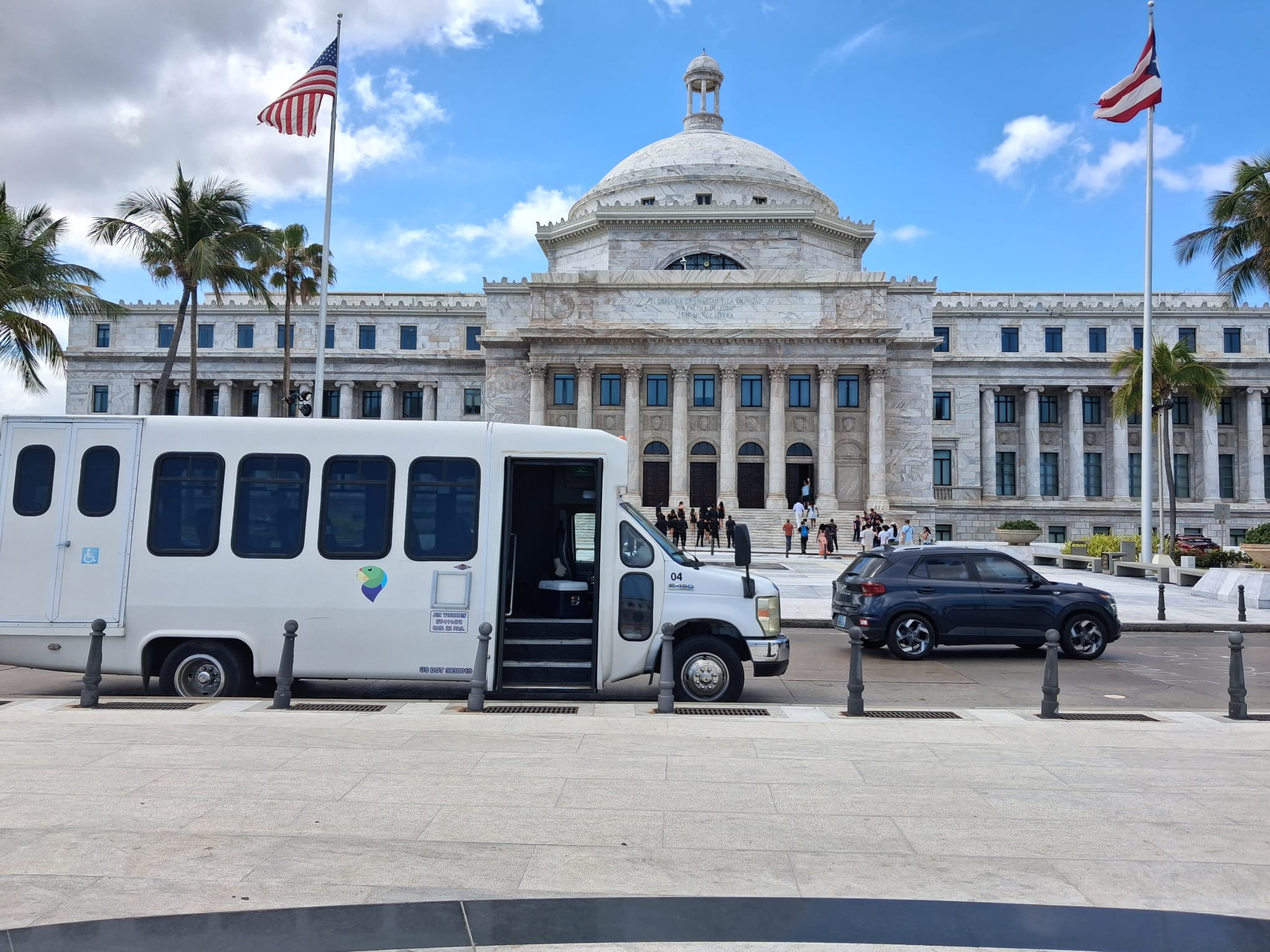 DP Transport accessible transport van parked in front of the Puerto Rico Capitol