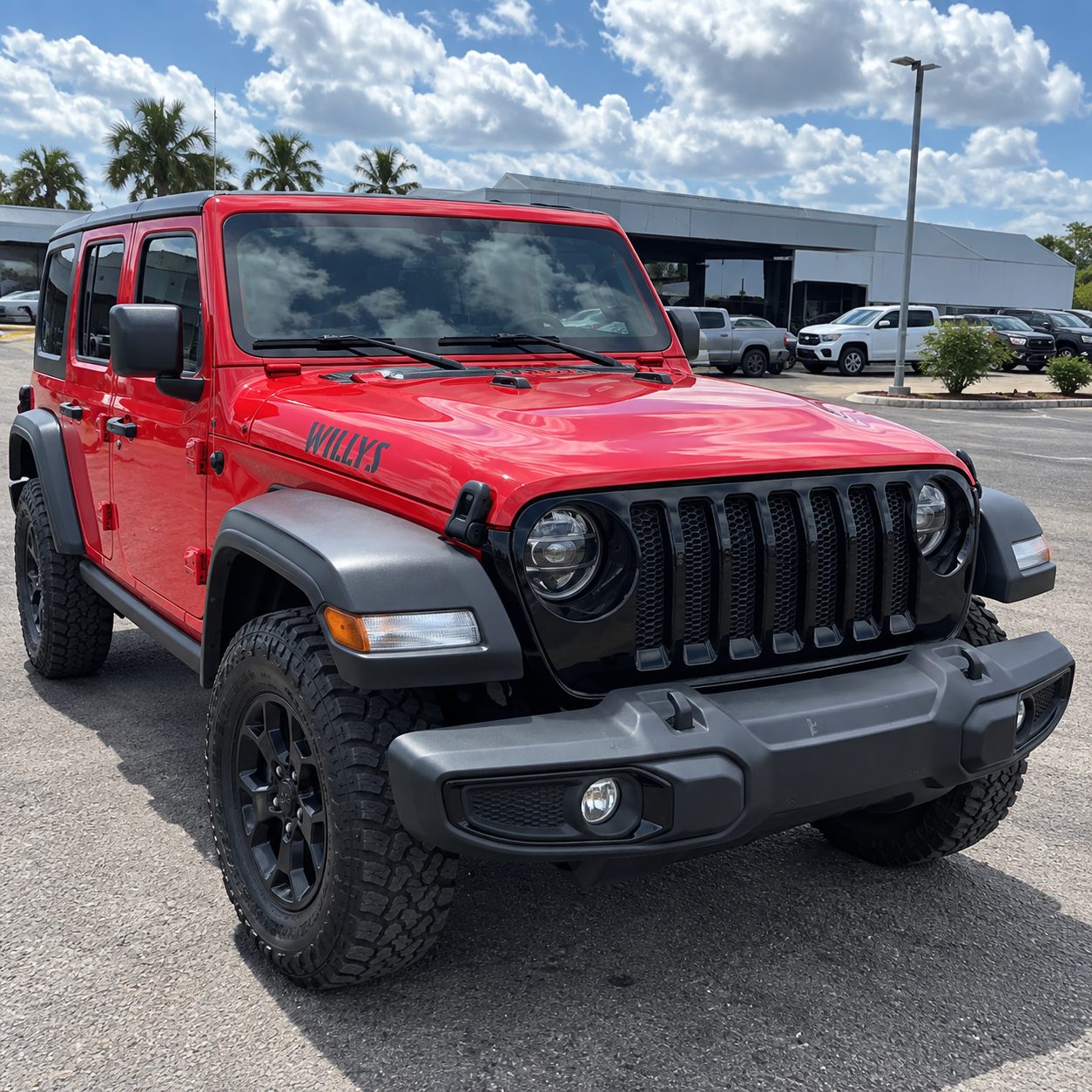 Big Red Jeep Wrangler Willys front passenger-side view