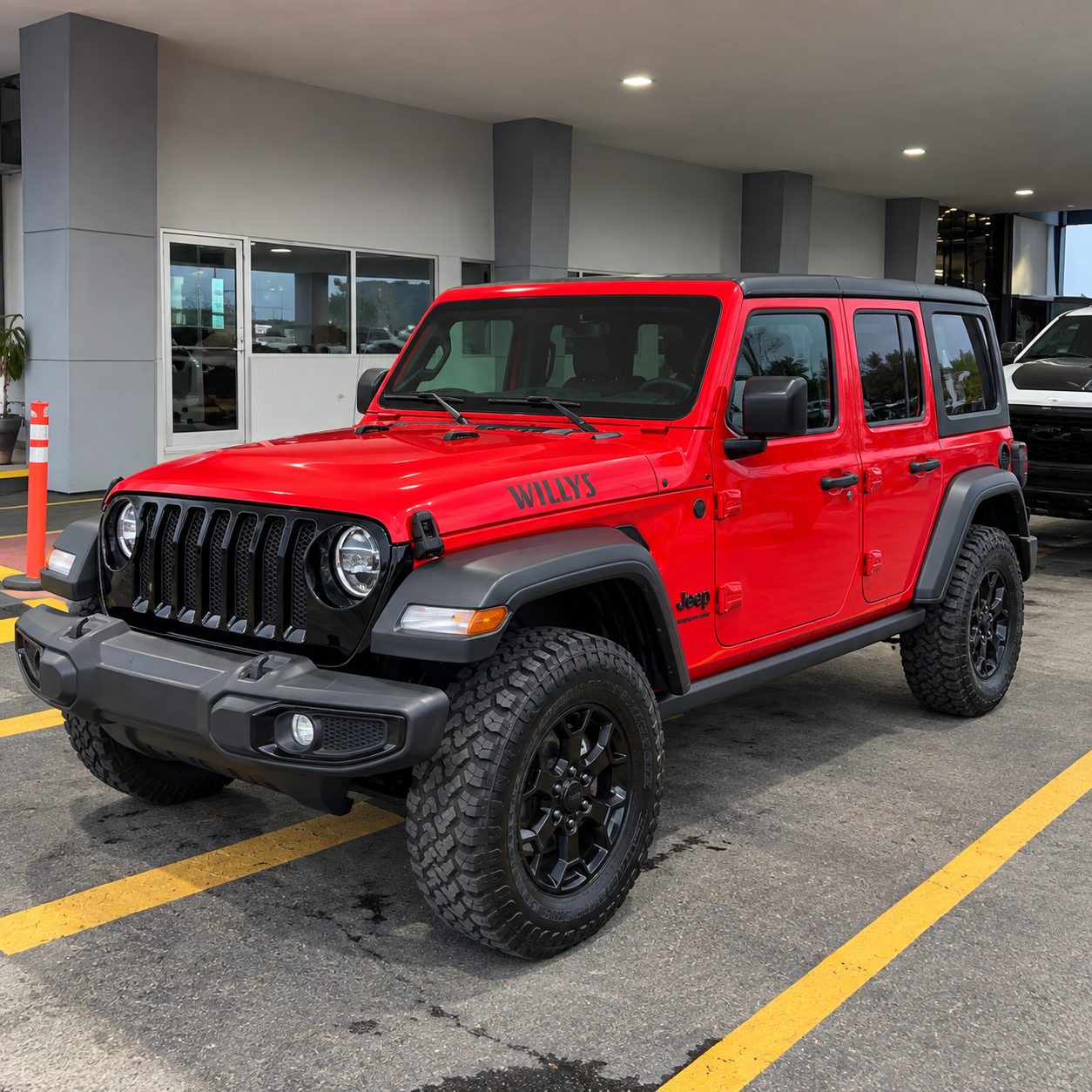 Big Red Jeep Wrangler Willys front driver-side view