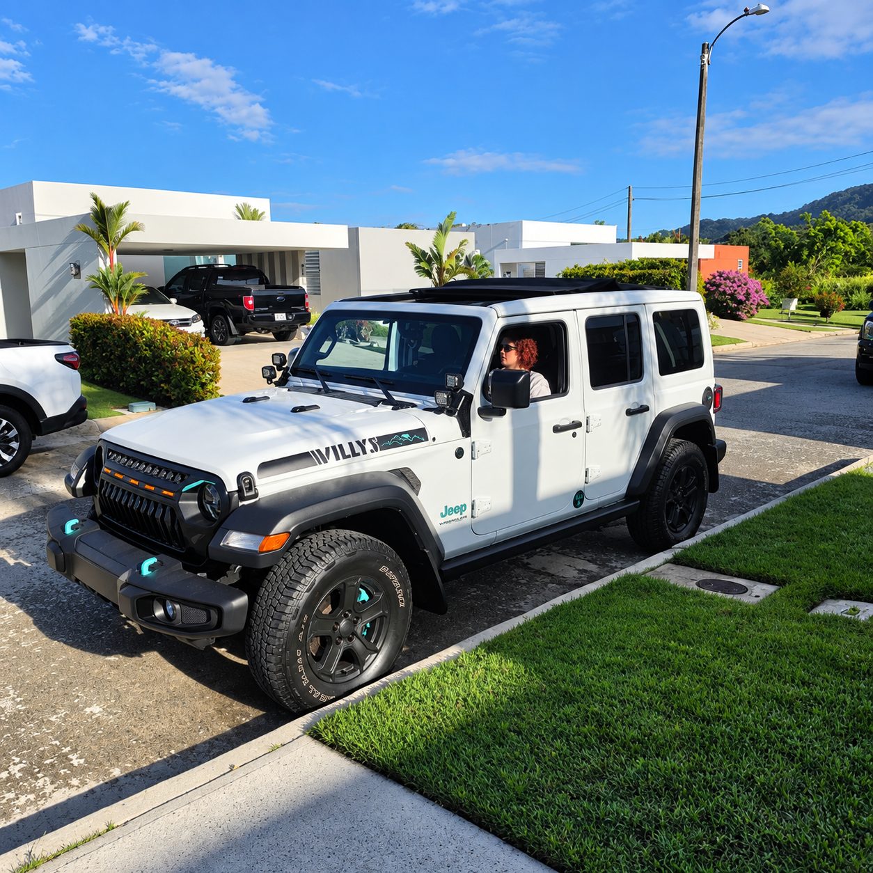 White Jeep Willys with the roof panels open, ready for pickup