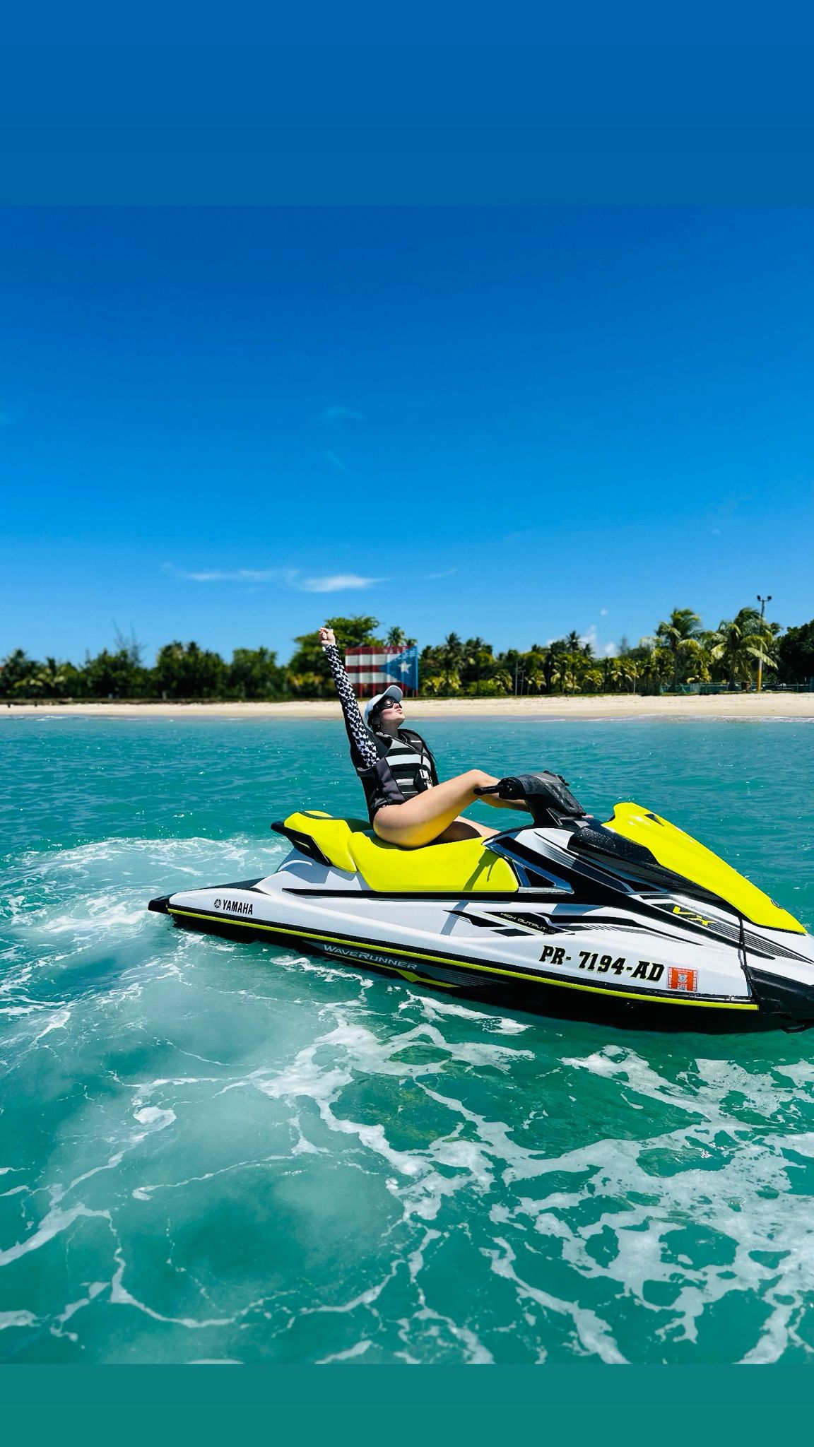 Yamaha WaveRunner jet ski rental rider on clear turquoise water in Puerto Rico